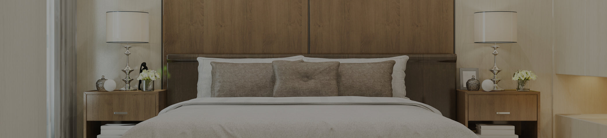 Bedroom with wooden headboard and nightstands with lamps